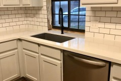 white-subway-tile-installation-around-arched-window