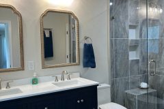 Bathroom-Floor-and-Shower-Tile-with-Glass-Door-scaled