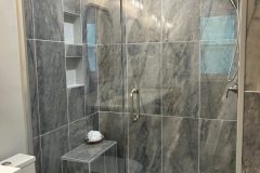 Bathroom-Shower-Tile-with-Tile-Seat-and-Glass-Door-scaled