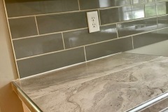 porcelain-kitchen-counters-and-subway-tile-backsplash