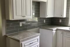 grey-subway-tile-kitchen-backsplash-behind-appliances